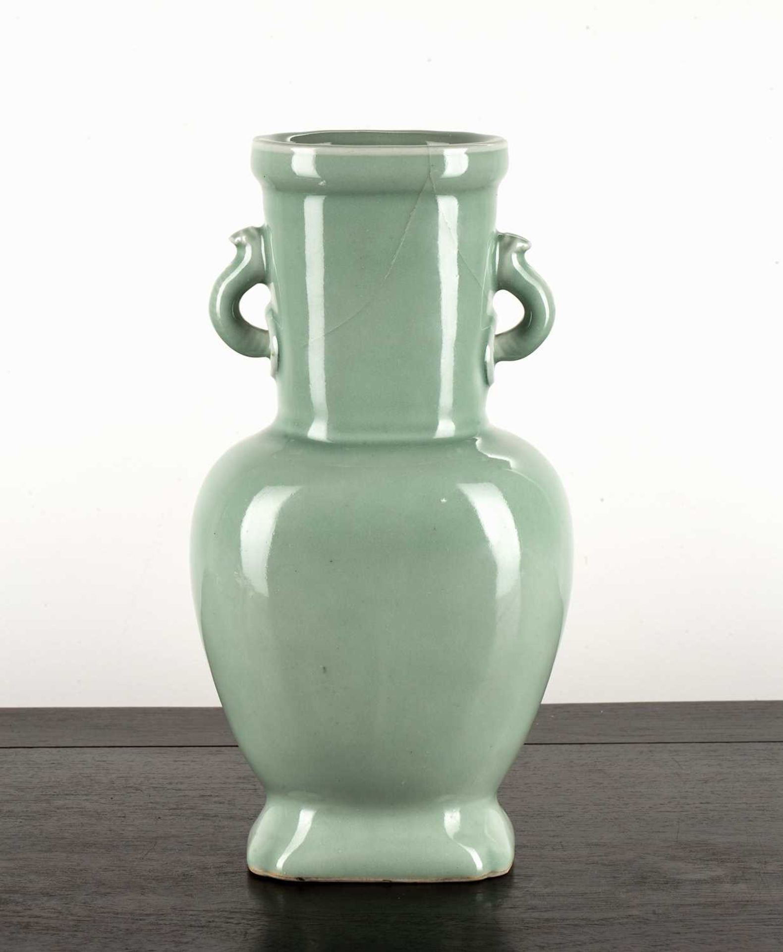 Celadon vase Chinese decorated all over with a pale green glaze, with two loop handles and