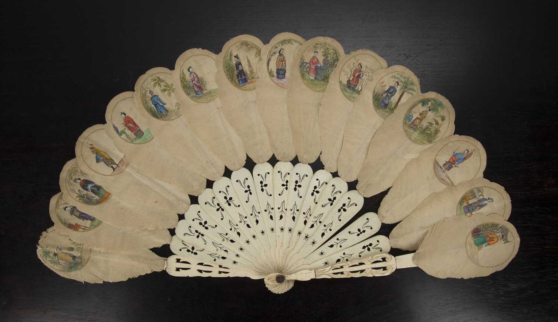 Silk and bone fan Chinese, late 19th Century painted with sixteen miniature oval figure studies,