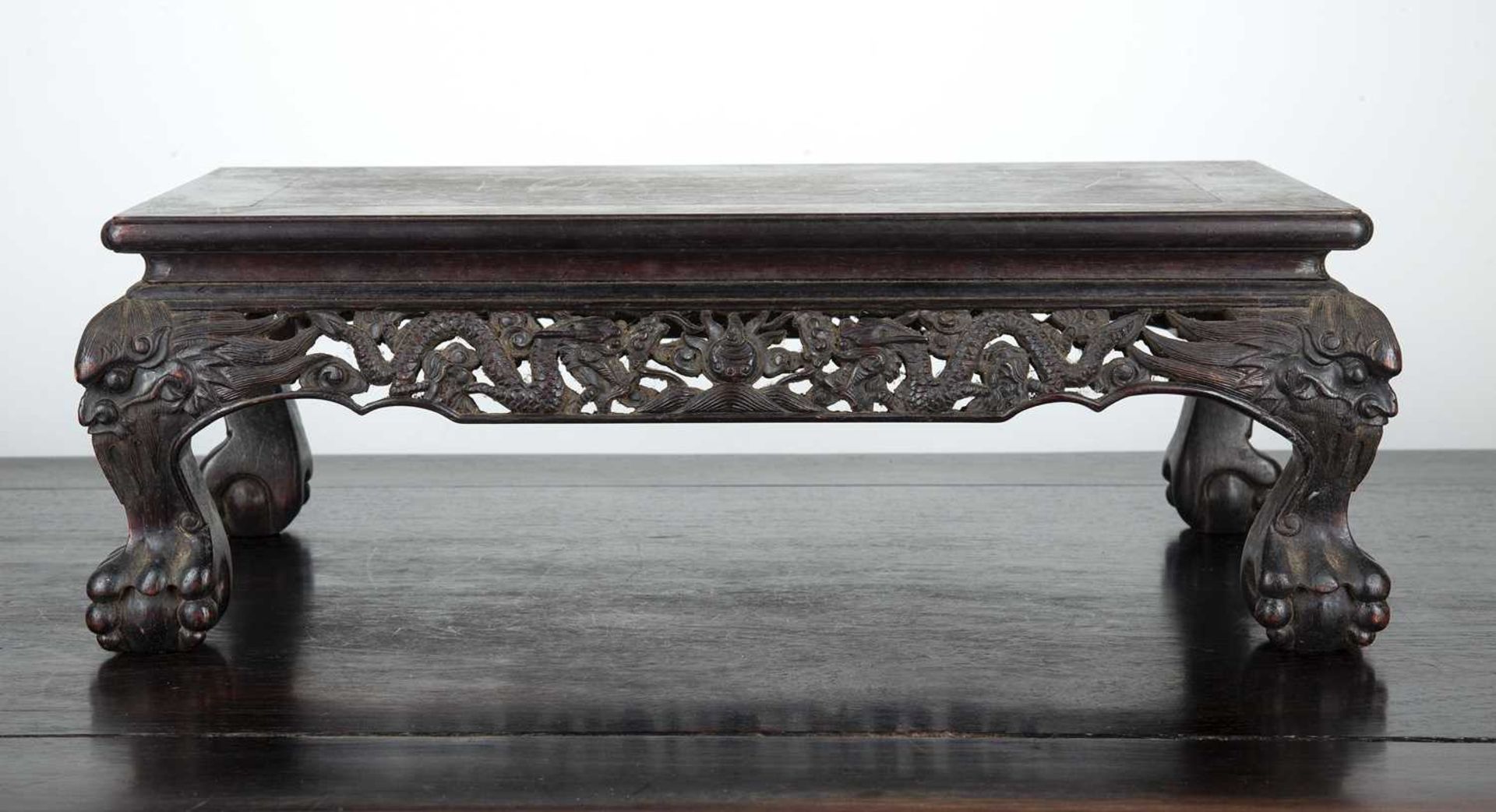 Hardwood rectangular table top stand Chinese, late 19th/ early 20th Century with carved dragon