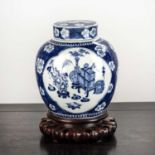 Blue and white lidded ginger jar Chinese, 19th Century decorated with a prunus leaf ground, with two