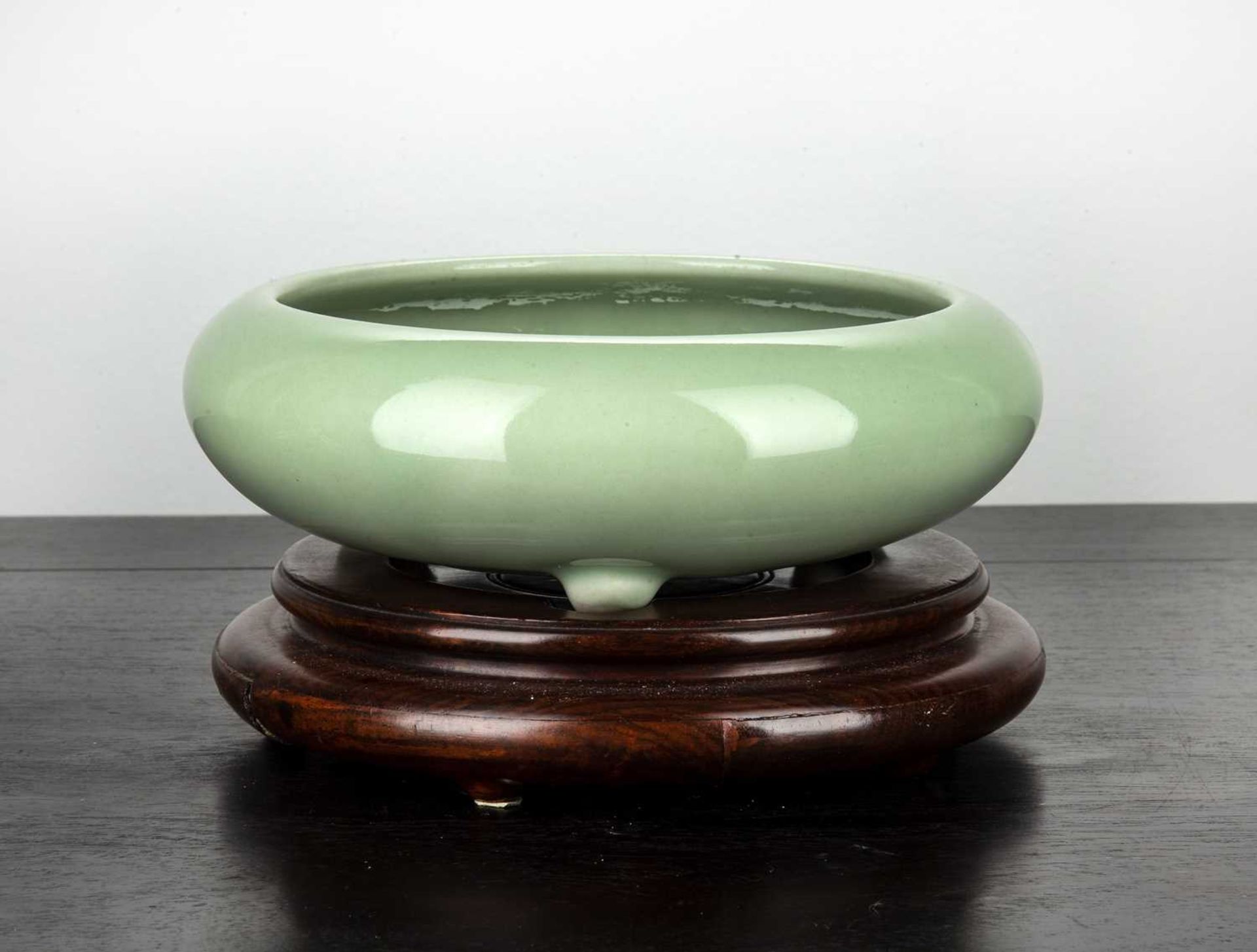 Plain celadon porcelain glazed shallow bowl Chinese, 18th/19th Century with inward turning rounded