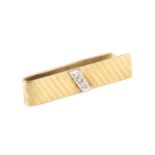 A diamond set money clip, applied with a horizontal channel of round brilliant-cut diamonds, 9ct two