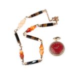 A banded agate necklace, comprising a line of alternating banded agate batons and carved panels,