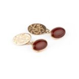 A pair of carnelian cufflinks, the oval carnelian cabochons in closed-back collet settings, on