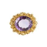 A 19th century amethyst single stone panel brooch, the oval mixed-cut amethyst in pinched collet