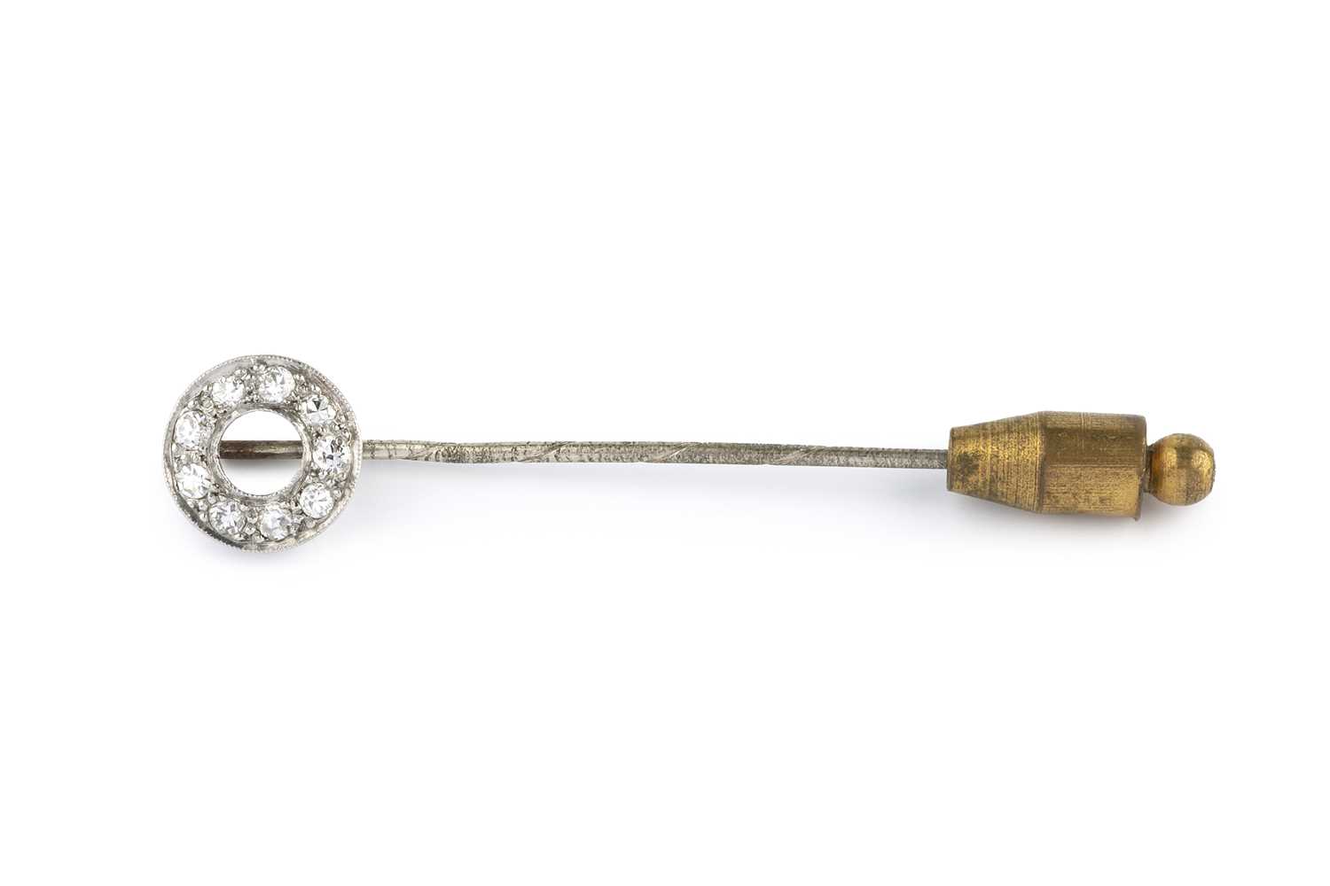 A diamond stick pin, the circlet terminal millegrain set with old and single-cut diamonds, white