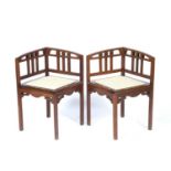 Glasgow School Pair of corner chairs, circa 1900 mahogany with brass inlay, inset fabric covered