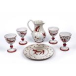 Alan Caiger-Smith (1930-2020) Jug, plate, and four goblets decorated with a red lustre on a white