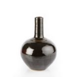 Ursula Mommens (1908-2010) Bottle vase treacle glaze impressed potter's seal 25.5cm high.