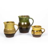 Sid Tustin (1913-2005) at Winchcombe Pottery Three jugs impressed pottery and potter's seals largest