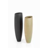 Manner of Joanna Constantinidis (1927-2000) Two flattened vessels with green and black glazes 23cm