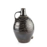 Michael Cardew (1901-1983) at Winchcombe Pottery Cider Flagon with a dark treacle glaze, sgraffito
