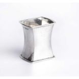 Omar Ramsden (1873-1939) An Arts and Crafts napkin ring silver, of planished, waisted rectangular