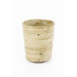 Lucie Rie (1902-1995) Beaker vase stoneware, with pitted oatmeal glaze impressed potter's seal 9.5cm