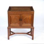 Peter Waals (1870-1937) from a design by Ernest Gimson (1864-1919) Cabinet on stand walnut with