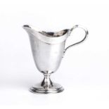 Omar Ramsden (1873-1939) An Arts and Crafts cream jug silver, with a planished helmet-shaped body,