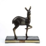 Art Deco Model of a fawn, circa 1920 cast metal on a stepped onyx base 32cm high.