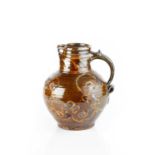 Michael Cardew (1901-1983) at Leach Pottery Jug, 1924-1926 treacle glaze with amber slip-trailed