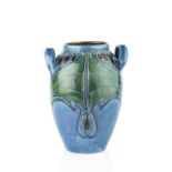 Charles H. Brannam An Art Nouveau twin-handled vase, 1905 tubeline decorated with green pattern on