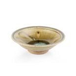 Jim Malone (b.1946) Footed dish with green ash glaze, incised decoration with blue glaze to the well