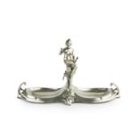 Style of W.M.F. Art Nouveau double fruit dish, circa 1900 pewter, modelled with a seated maiden with