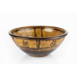 Michael Cardew (1901-1983) at Winchcombe Pottery Bowl slipware with dark pattern over honey ground