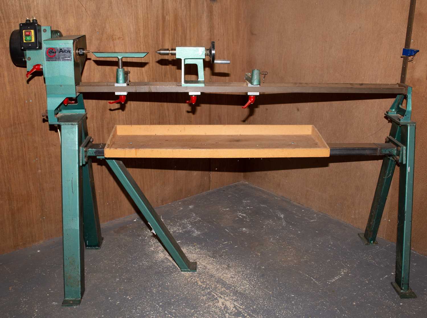 A Thyme Machines (Bristol) Ltd woodworking lathe on an integral stand, the bed 149cm long, serial