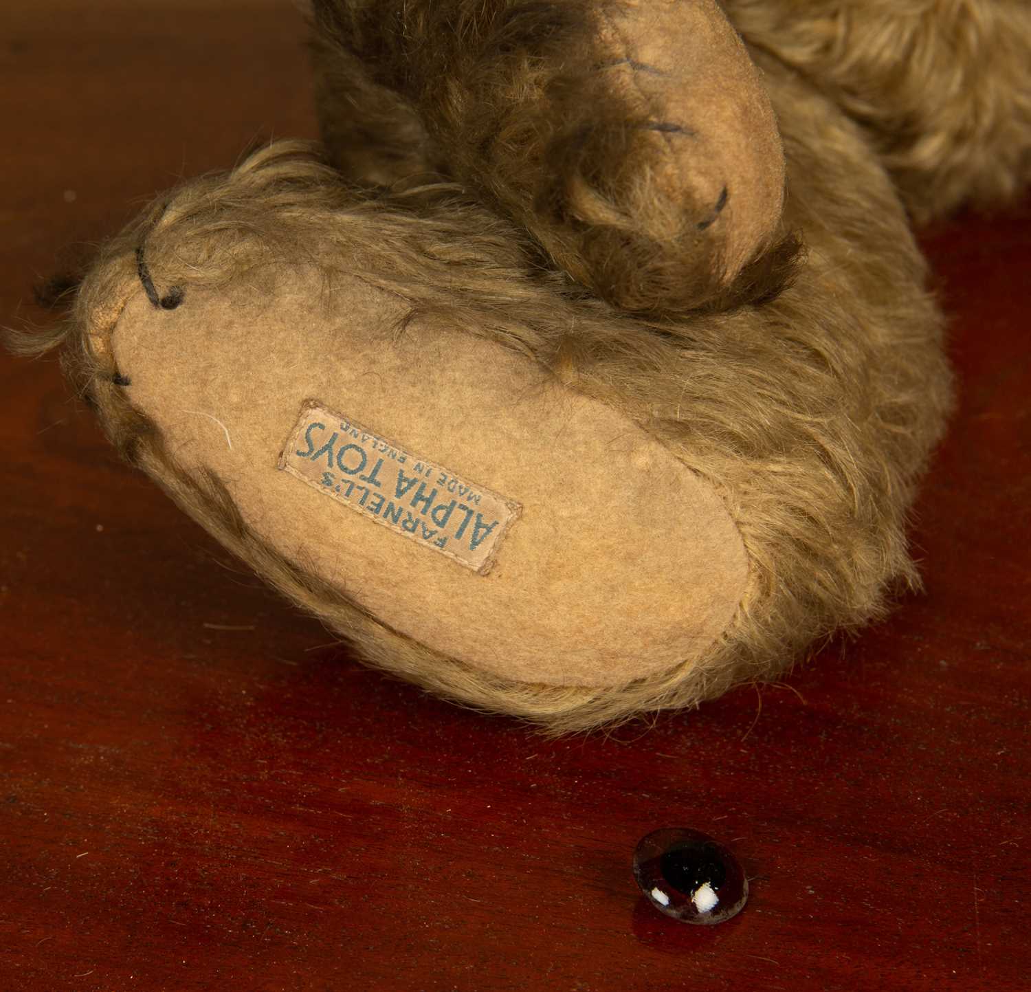 An early 20th century Farnel teddy bear with a 'Farnel's Alpha Toys' label to the foot, 46cm in - Image 3 of 3