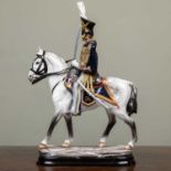 A Michael Sutty porcelain figurine of an Officer of the Royal Horse Artillery 1828, number 49 from