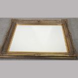 A large gilt framed wall mirror