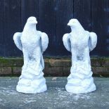 A pair of reconstituted stone eagles