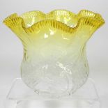 A yellow glass oil lamp shade