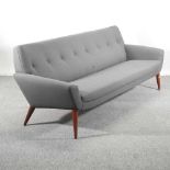 A 1960's style grey upholstered sofa