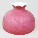 A small red satin glass oil lamp shade