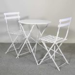 A white painted patio set