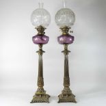 A pair of Victorian style brass oil lamps and shades