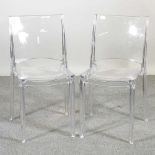 A pair of perspex ghost chairs