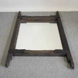 A rustic wooden framed wall mirror
