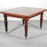 A Victorian mahogany dining table