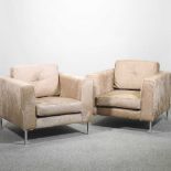 A pair of fur upholstered armchairs