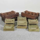 Ten green wooden crates