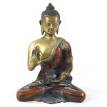 A bronze figure of a Buddha