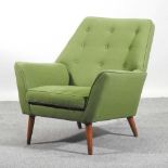 A 1960's green upholstered armchair