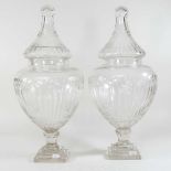 A pair of cut glass lidded jars