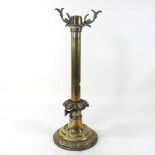 An 19th century patent brass candle lamp