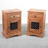 A pair of modern hardwood bedside cabinets