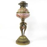 An ornate 19th century brass oil lamp