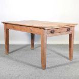 An antique pine kitchen table