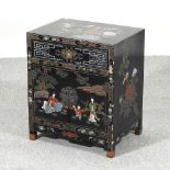 A Chinese lacquered cabinet