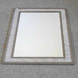 A metal framed wall mirror